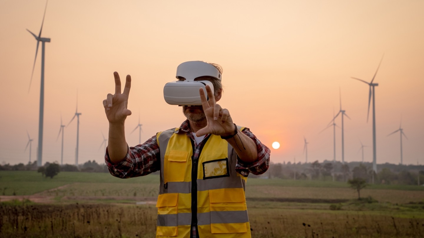 Engineer With VR Wind Turbines In The Background